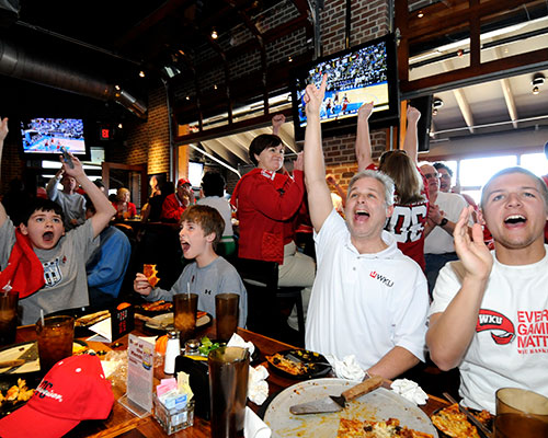 WKU Basketball fans cheering at Double Dogs Bowling Green.