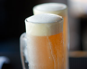 Draft beer in a frosted mug.