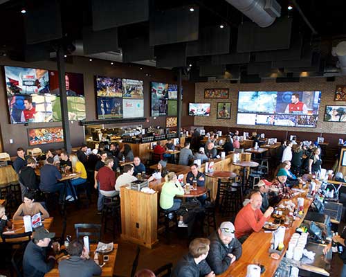 Double Dogs Kingston Pike interior with big TVs.